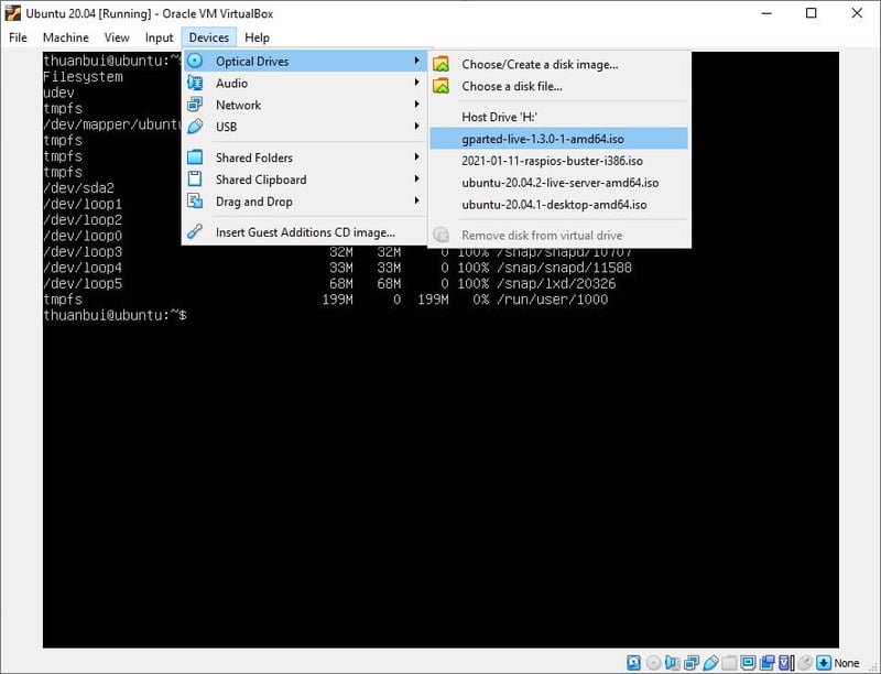 Chọn file gparted-live-1.3.0-1-amd64.iso, sau đó khởi động lại máy ảo